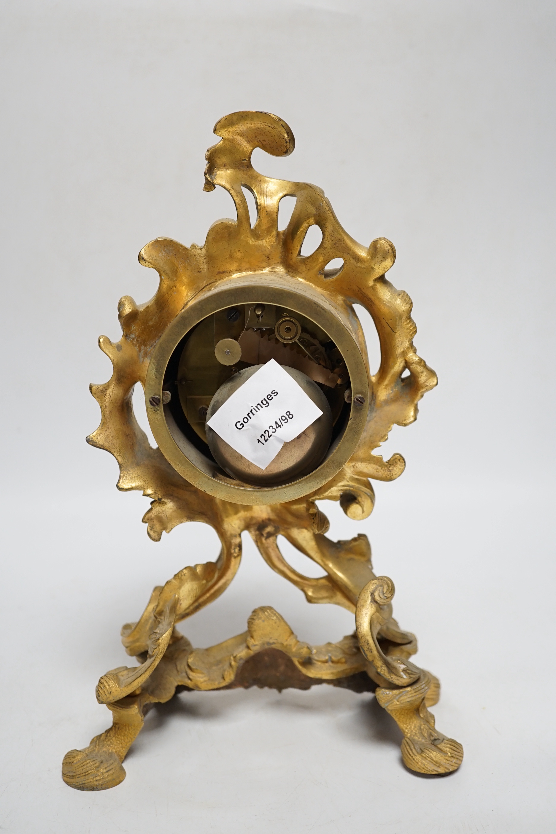 A 19th century French rococo-style ormolu mantel clock with Raingo movement striking on a bell (missing pendulum), 29cm
